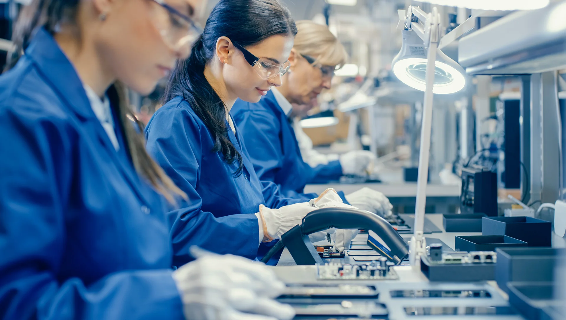 Electronics assembly line with ESD workstations